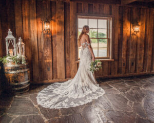 bride posing and standing by window