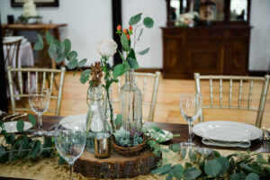 wooden reception table with natural decor