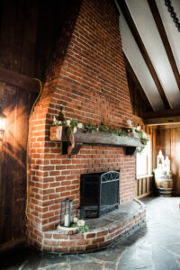 brick fireplace decorated with flowers