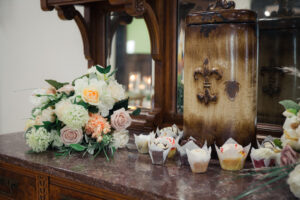 bouquet and cupcakes on granite countertop