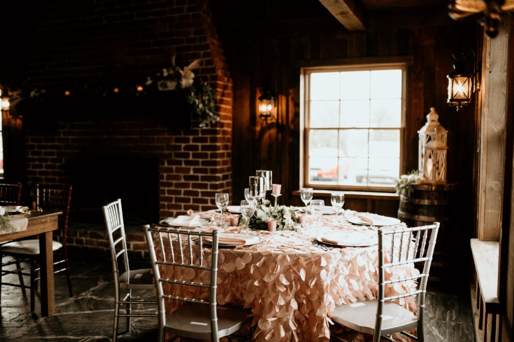 rustic wedding reception with pink accents
