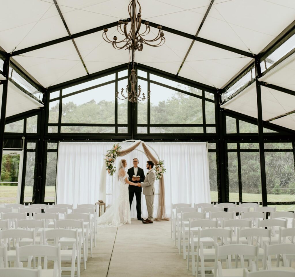 small wedding ceremony in outdoor tent