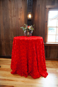 small round table with red table cloth